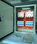 Inside view of No Sweat 500A DC Combiner Box 4 To 2 Out Pre Wired Cable Kit showing internal wiring and bus bars for battery bank.