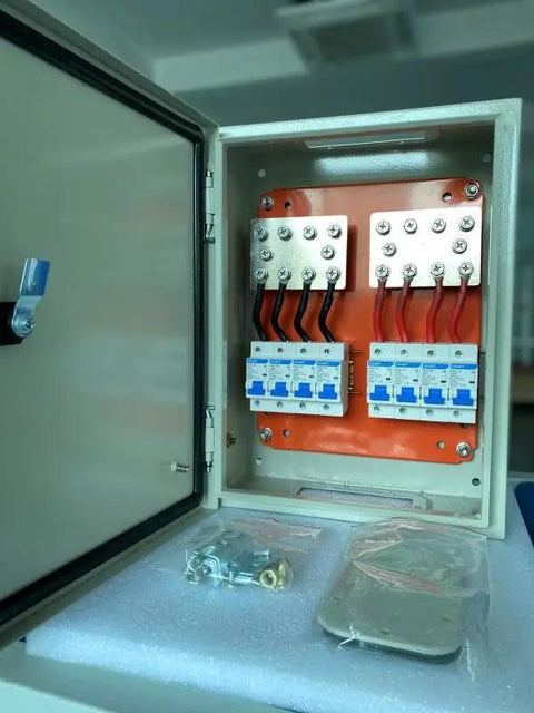 Inside view of No Sweat 500A DC Combiner Box 4 To 2 Out Pre Wired Cable Kit showing internal wiring and bus bars for battery bank.