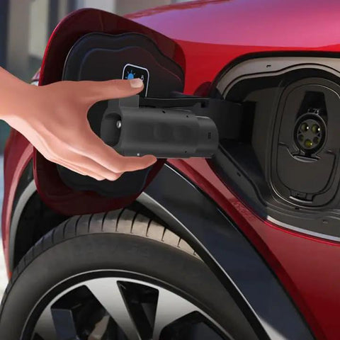 Person using Premium Nacs To J1772 EV Charger Adapter Delivering 80 Amp 19 Kw on electric vehicle charging port.