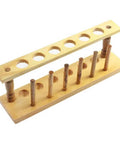 Six Hole Wooden Test Tube Rack With Six Drying Pins For Home Lab, School, And Classroom Use, Durable Wood Holder, angled view