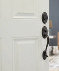 Shelburne Single Cylinder Handleset With Lido Lever And SmartKey In Venetian Bronze on white door