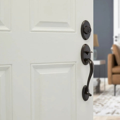 Shelburne Single Cylinder Handleset With Lido Lever And SmartKey In Venetian Bronze on white door