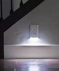 Two Pack Wall Plate Night Lights LED Built Into Outlet Plates Duplex White Auto On Off shown installed near stairs.