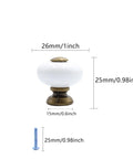 Ceramic Round Knob Set One Inch White And Antique Brass Cabinet Hardware with measurements for drawers and doors.