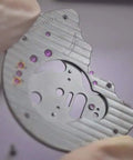 Close-up of hands wearing disposable latex finger cots holding a metal component; Disposable Latex Finger Cots 350 Pcs Medium Anti Static Rubber Fingertip Protectors For Electronics Repair Do It Yourself Friendly Cleanroom Ready Medical Semiconductor Crafting Beauty And More visible.