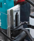 Makita HB350 1-3/8 inch magnetic drill; teal body with vertical metal guide, side view.