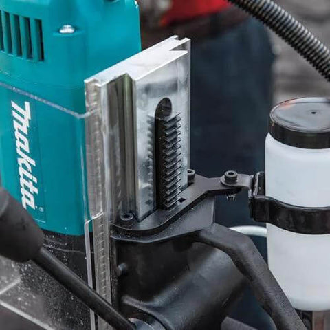 Makita HB350 1-3/8 inch magnetic drill; teal body with vertical metal guide, side view.