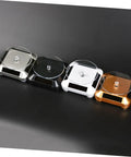 Solar Powered Rotating Jewelry Display Stand With Built In Kickstand in silver, black, white, and gold colors on a black background.