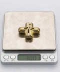Four Pack Zinc Alloy Invisible Cross Hinge for Wooden Doors and Tables shown on digital scale for weight measurement