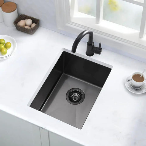 Undermount Bar Sink 12x16 Inch Deep Black 16 Gauge Stainless Steel Single Bowl With Bottom Grid And Drain Assembly installed in kitchen.