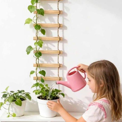 Child watering plants next to 6-Feet Extra Tall Wooden Ladder Plant Trellis For Indoor And Outdoor Use, 15-Section Natural Wood Climbing Support For Vines Ivy Pothos Monstera, Sturdy Rust-Free Easy Assembly Dope Space-Saving For Balconies And Gardens.