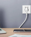 Straight Up Wall Outlet With Dual Usb Ports 5V 2 1A Fast Power 16A EU Standard plugs into a wall beside a laptop.