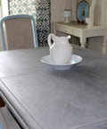 Straight Up Heavy Duty Reactive Water Based Interior Wood Stain Generates A Relaxed Coastal Driftwood Vibe Fully Voc Free on a gray-stained table.