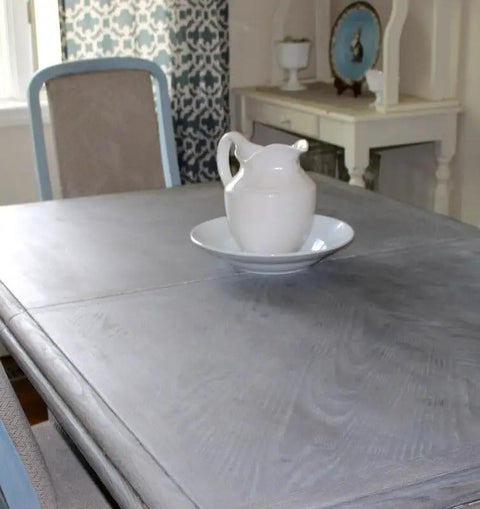 Straight Up Heavy Duty Reactive Water Based Interior Wood Stain Generates A Relaxed Coastal Driftwood Vibe Fully Voc Free on a gray-stained table.