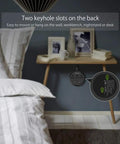 Compact Three Outlet Power Strip With Two USB Ports And Flat Plug Five Foot Cord Wall Mountable on nightstand beside bed