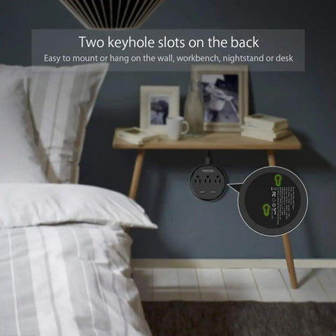 Compact Three Outlet Power Strip With Two USB Ports And Flat Plug Five Foot Cord Wall Mountable on nightstand beside bed