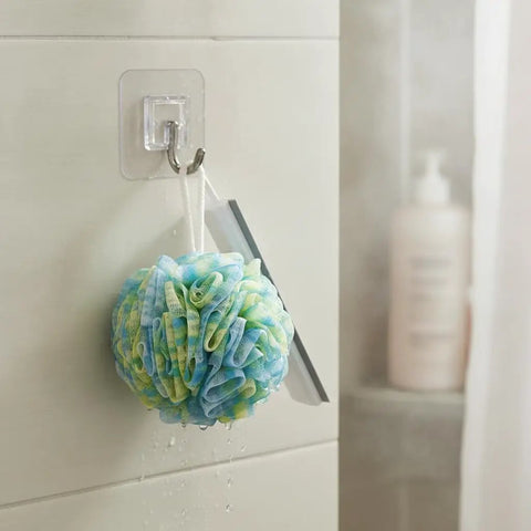 Sick Wall Mount Hooks, Totally Rust Proof Storage Rack for hanging a colorful shower loofah in a bathroom setting.