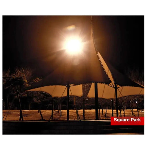 Heavy Duty Led Tower Floodlight Waterproof Job Site Search Lamp With Badass 1000 Watt Glow illuminating a park at night.