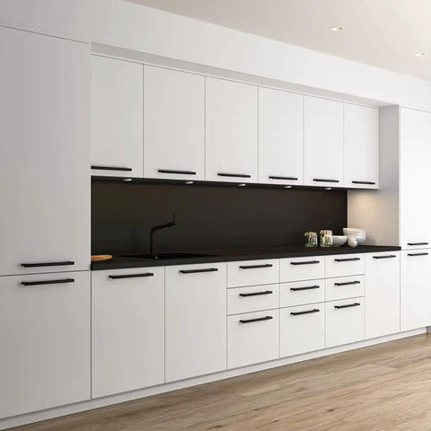 Modern kitchen featuring Top Tier Whittier Cabinet Pull In Sleek Matte Black With 5 1/16 Inch Center To Center on white cabinets.
