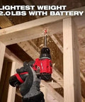 User operating a Compact Brushless Cordless Drill Driver Kit With Heavy Duty Metal Chuck on raw wood framing.