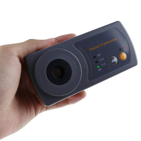 Hand holding Sound Level Calibrator For Meters 94dB 104dB 114dB With 1kHz Reference Half Inch Microphone lab tool shown front view