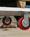 Heavy Duty Electric Lifting Elevator Mobile Lift Truck Folding Flatbed Cart For Warehouse Freight Handcart Easy Storage In Trunk wheels close-up view.