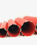 Six red diamond-segmented wet core drill bits in varying diameters.