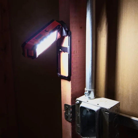 Go To Rechargeable LED Work Light With Kickstand And Magnetic Mount in use on wooden surface next to electrical conduit