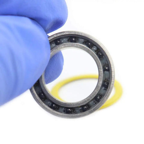 Ceramic Hybrid Radial Bearing For Bike Hubs 15x24x5mm with PA66 Cage and Ceramic Balls in gloved hand