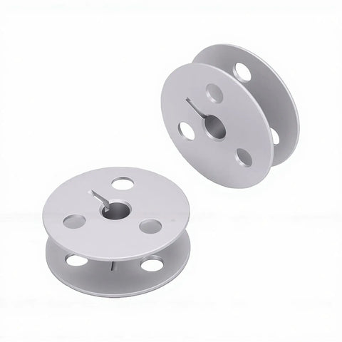 Heavy Duty Four Hole Aluminum Bobbin With Cnc Machined Precision Balance Dead Nuts Exact Alignment And Smooth Operation For Durkopp 1767 767 867 887 Industrial Sewing, showing two gray bobbins.