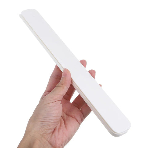 Hand holding a single piece from 2 Pack White Plastic Drawer Slides for Kitchen Cabinets and Drawers, plug and play easy install.