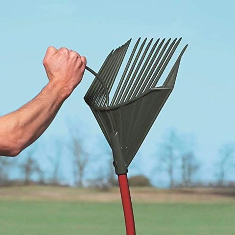 Heavy Duty Garden Rake That Slays Leaves And Debris With Ease Sturdy Tines Do Not Bend Under Pressure Ergonomic red handle shown outdoors
