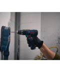 Person using Ultra Compact 12V Max Hammer Drill And Driver Kit With 3/8 Inch Auto Chuck Two Speed Control For Torque And Drilling
