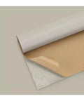 Big Faux Leather Repair Patch For Couch Car Boat Seats And More Self Adhesive Quick DIY Fix Waterproof Scratch Resistant Residue Free Thick PU Leather Patch For Upholstery Durable Easy To Peel And Stick 150x138 Cm 55x19 In, shown rolled out with adhesive side visible.