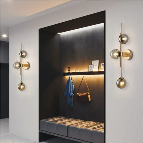 Mid Century Modern Indoor 3 Light Globe Wall Sconce With Smoke Gray Glass Shade And Brushed Brass Finish Vertical Vanity Lamp for Modern Bathrooms Retro Handblown Glass Look Elegant Gold Accents installed in hallway