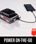 Power Core 20 Brushless Cordless Drill Driver Kit 2.0Ah Battery charging a phone