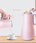 Grab And Go Kickass Vacuum Insulated Travel Thermos With Secure Silicone Lid Locks In Scalding Heat Or Ice Cold Temperatures All Day Long Killer For Daily Commutes being poured into a cup.