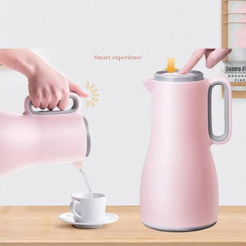 Grab And Go Kickass Vacuum Insulated Travel Thermos With Secure Silicone Lid Locks In Scalding Heat Or Ice Cold Temperatures All Day Long Killer For Daily Commutes being poured into a cup.