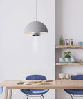 A stylish kitchen dining area with a Freestyle Socket Adapter Turns Any Table Or Floor Into A Screen, Compatible With E26 And E27 Home Sockets.