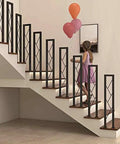 Legit Top Shelf Black Wrought Iron Handrails Built Tough For Steps And Decks Secure Guardrails For Kids And Seniors Porch Railing Kit Easy Ground Mount Ten Pieces Ready To Go with a girl on indoor staircase.