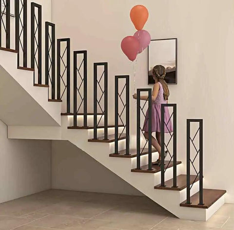 Legit Top Shelf Black Wrought Iron Handrails Built Tough For Steps And Decks Secure Guardrails For Kids And Seniors Porch Railing Kit Easy Ground Mount Ten Pieces Ready To Go with a girl on indoor staircase.