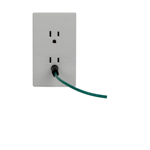 Wall outlet with a green cord plugged in, representing Two In One Dryer Adapter And Extension Cord 10 30P to 14 30R Heavy Duty.