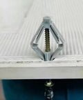 Butterfly Shaped Nylon Drywall Anchors Heavy Duty with Internal Threads for Metal and Gypsum Board in use on white panel