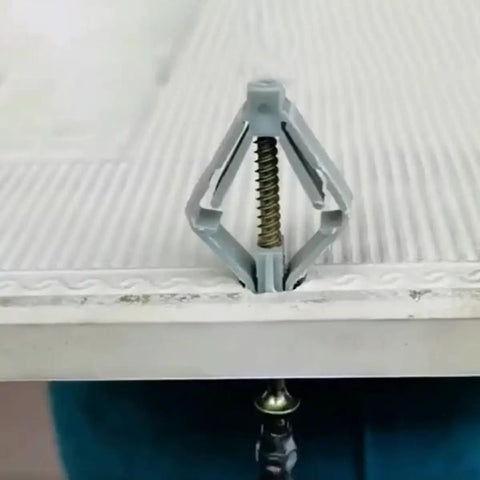 Close-up of a butterfly-shaped nylon drywall anchor from the 400 Piece Heavy Duty Drywall Anchors Assortment Kit With Butterfly Shaped Nylon And ABS Expansion Anchors For Gypsum Board And Wood Easy To Install Wall Fixings For Construction.