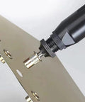Rivet nut (3/8-16), carbon steel, installed into metal panel with rivet nut tool; close-up