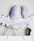 Creative Bird Wall Mounted Coat Rack No Sweat Entryway Setup Rock Solid Hooks For Coats Hats And Keys Easy DIY Mount Multi Room Home Storage Solution with purple birds on a leaf design.