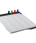 Heavy Duty Solderless Breadboard With 3220 Holes, view of black aluminum back plate and color-coded terminals.