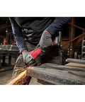 Top Notch Paddle Switch Replacement Kit For 18V Cordless Angle Grinders in use, featuring anti-vibration grip handle during grinding.