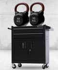 Heavy Duty Portable Tool Box Cart With Double Drawers, Mobile Metal Tool Cabinet For Auto Repair And Garage in black with kettlebells on top.