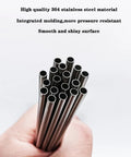 Close-up of 1/2 in OD stainless steel tubes held in hand; bundle of straight metal tubing
